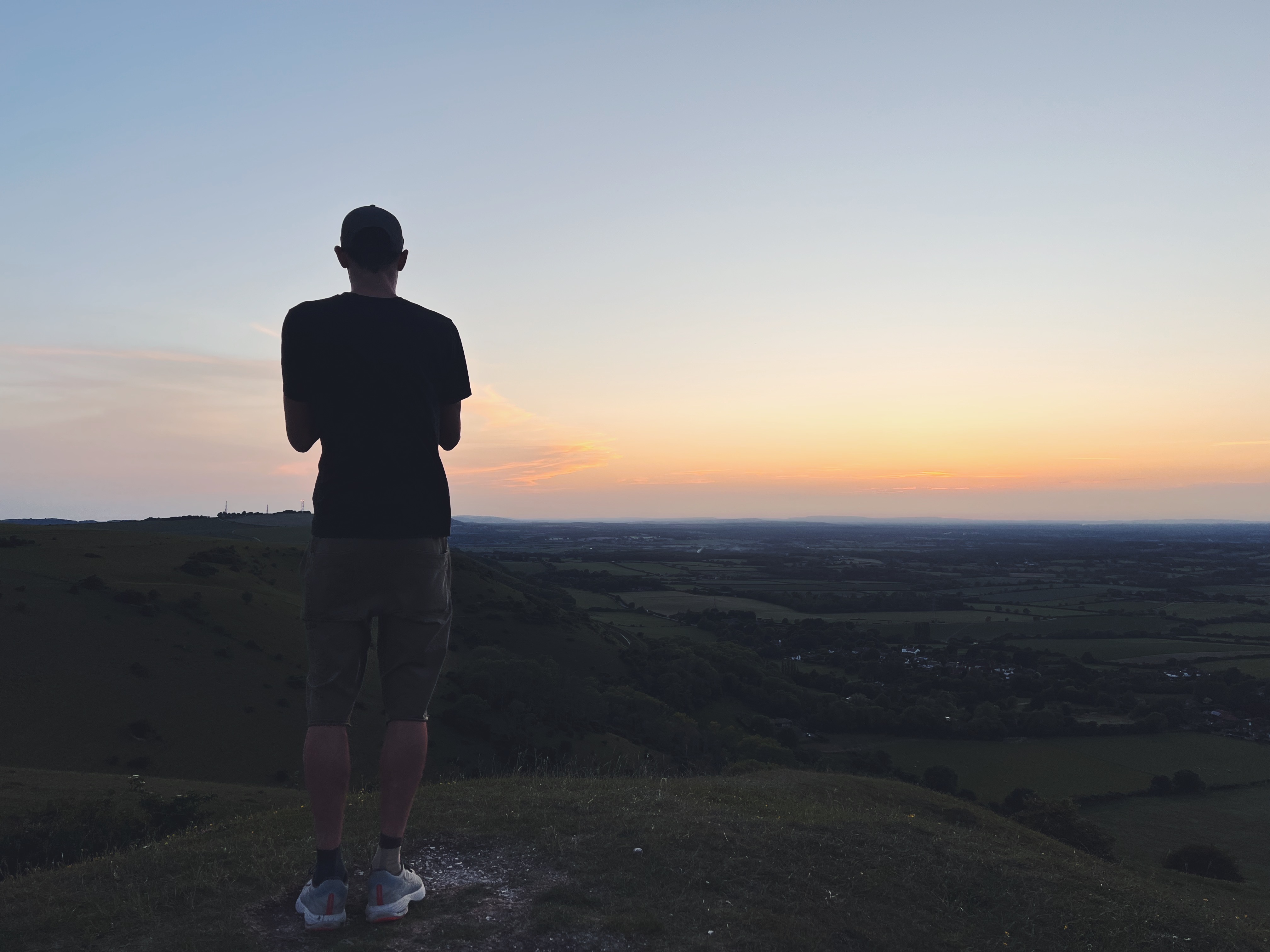 Lachie at sunset looking over the downs