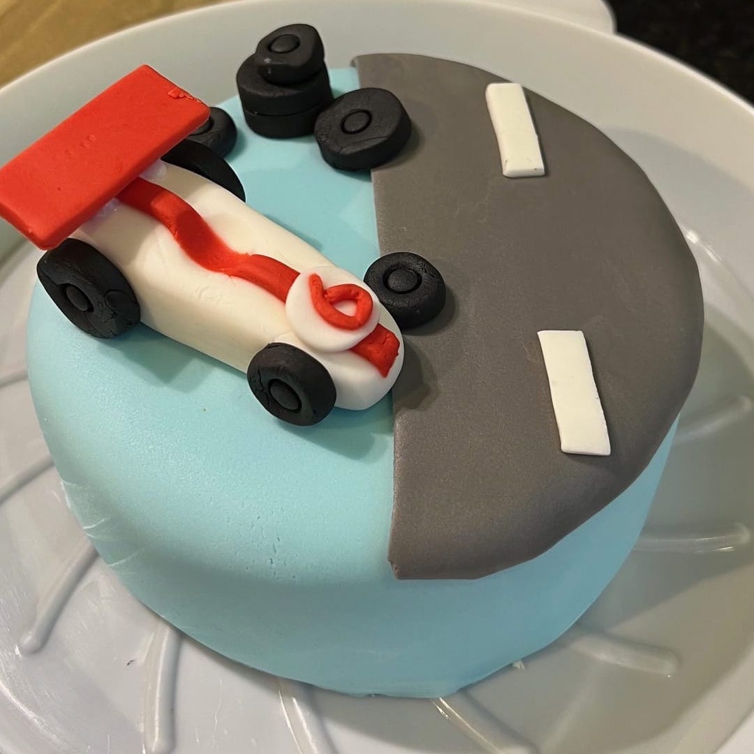 Blue vegan sponge cake with sugar paste racing car