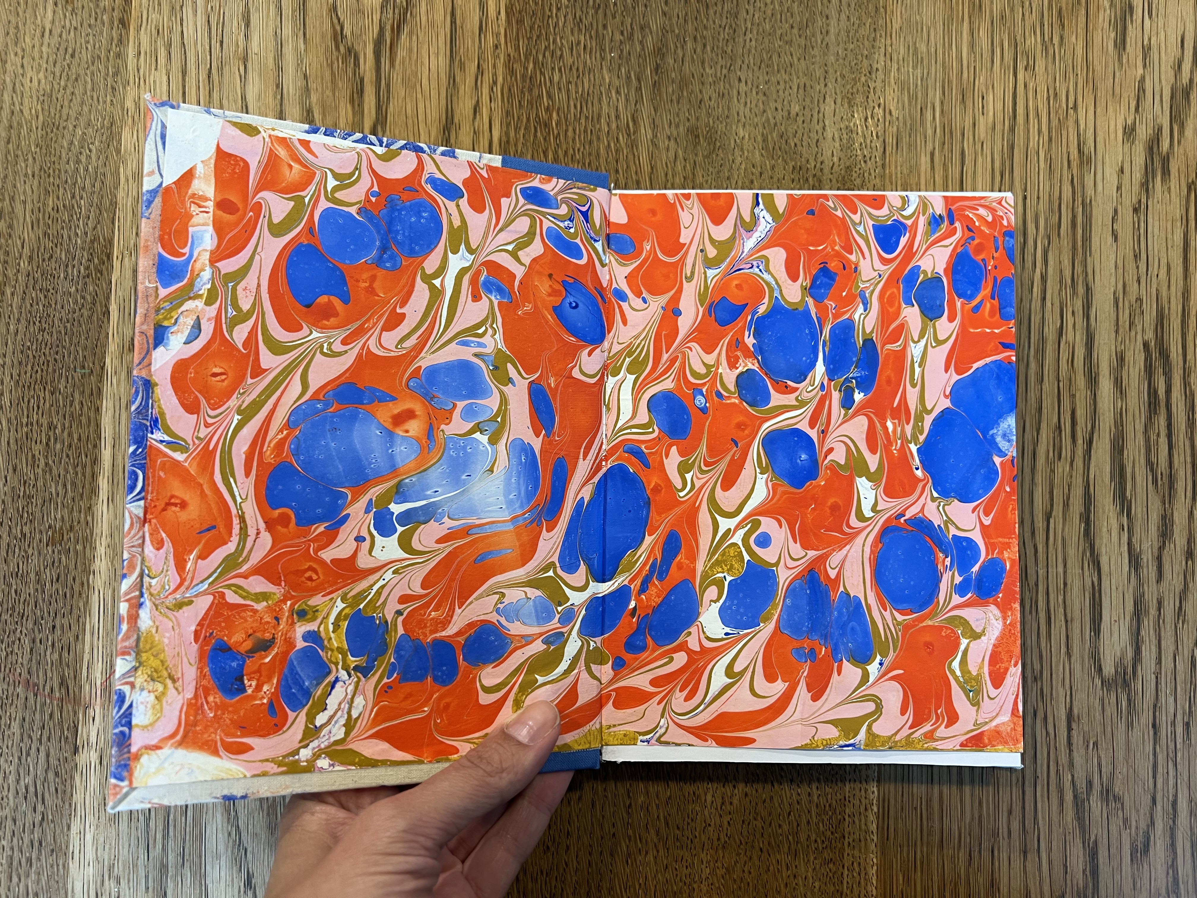 Open book showing marbled end paper