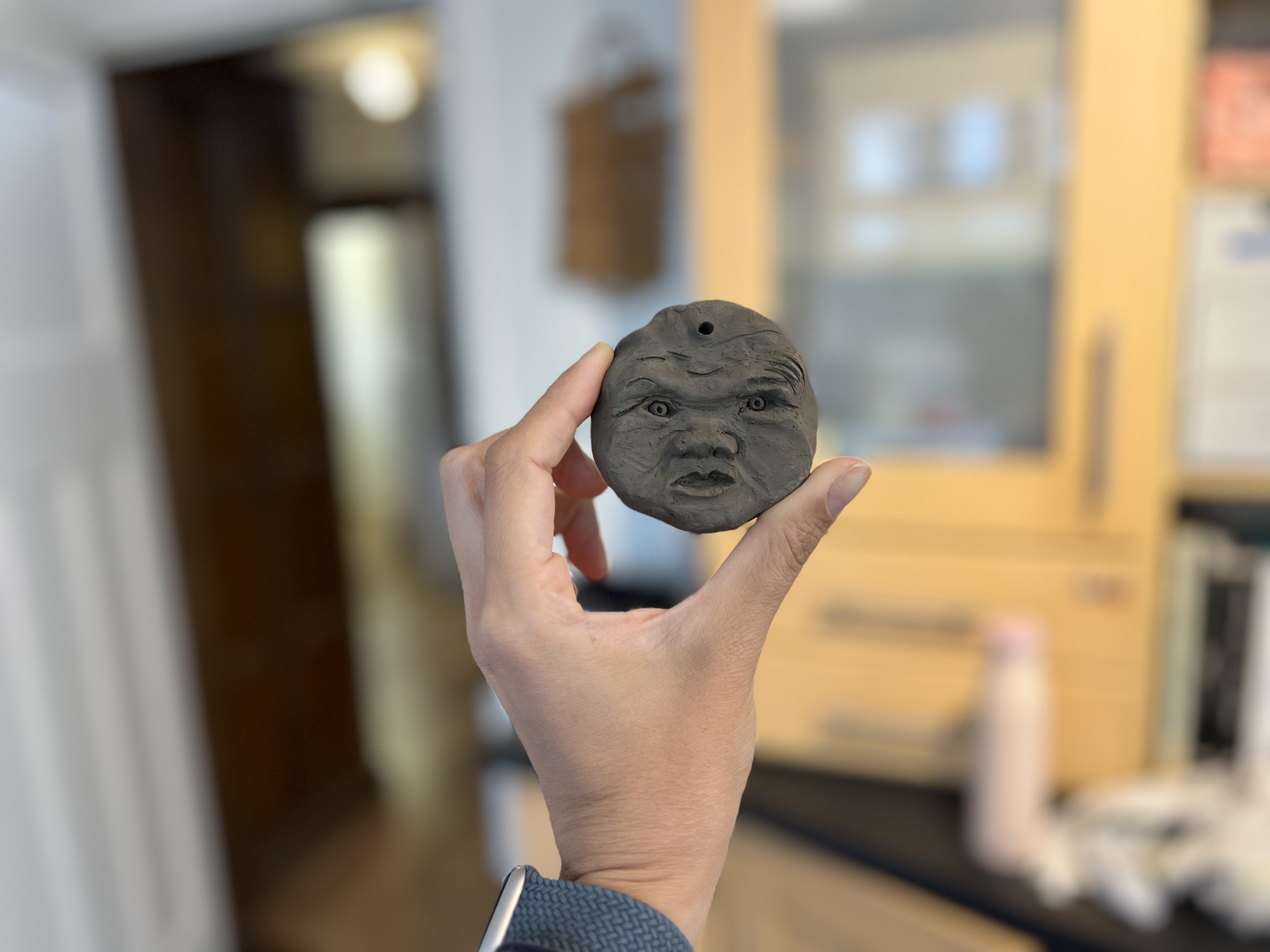 clay sculpture of E as a baby