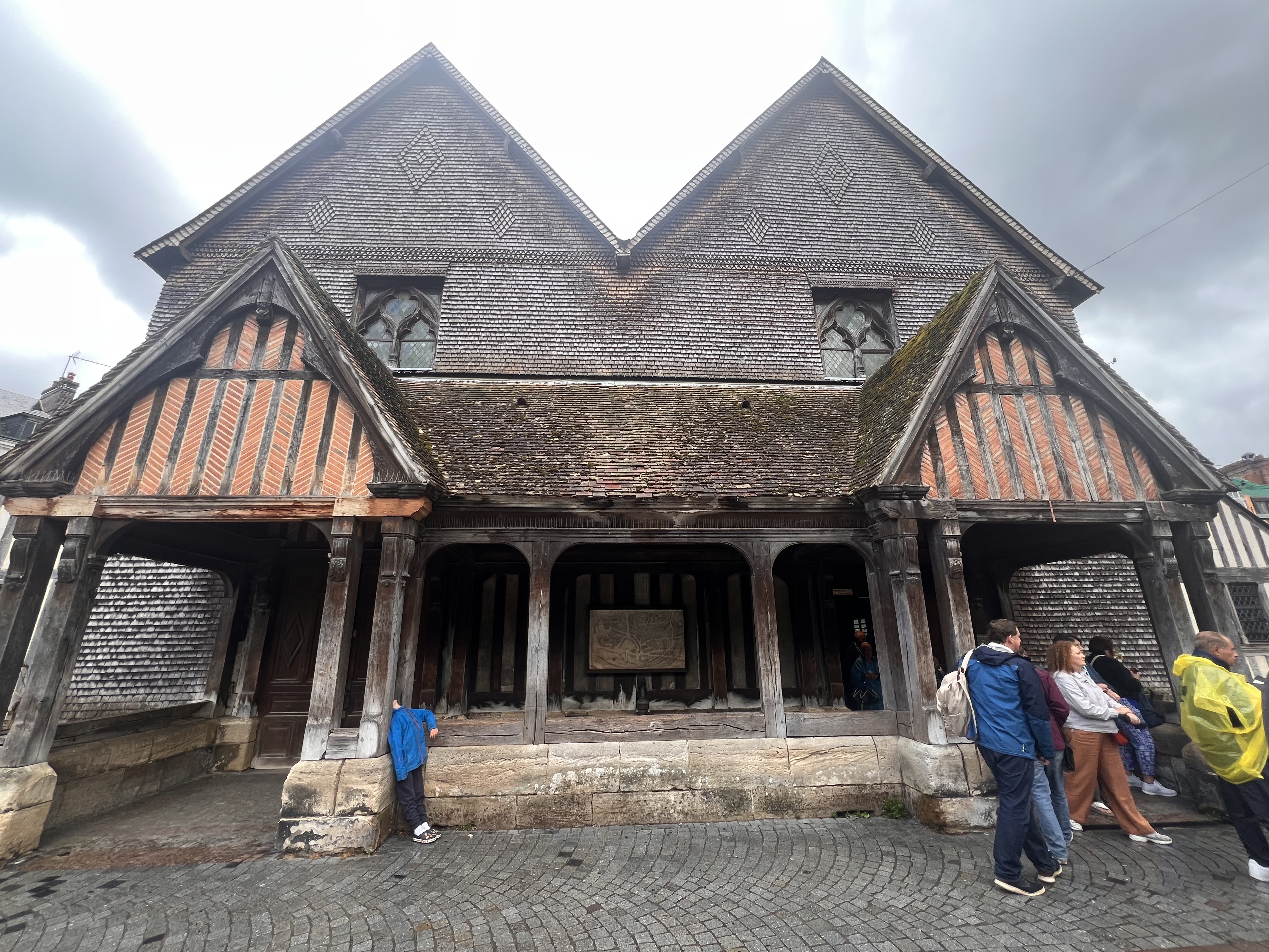Wooden Church in Honfleur with unimpressed son